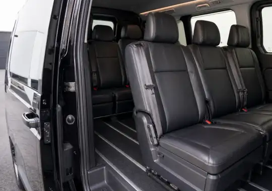 Family seated inside a spacious Melbourne maxi taxi with child seats